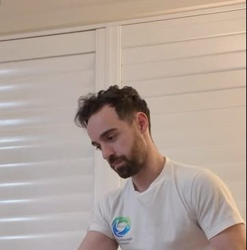 Chris treating a client's arm on the table
